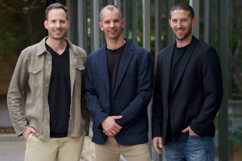 Glow founders: Roi Tiger, Omer Singer, and Ophir Arie, photographed at the company's Tel Aviv office