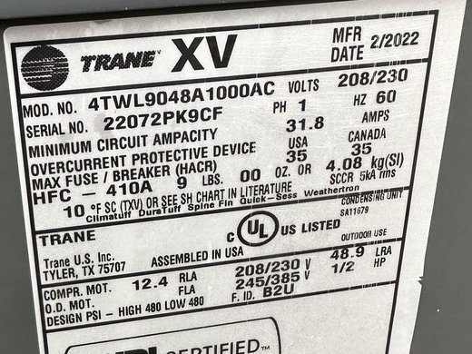 A close-up of an HVAC nameplate photographed on-site by a technician during a service job. Kebra's field capture prompts the tech for this photo when the serial number is missing from the recording. Source: kebra.com